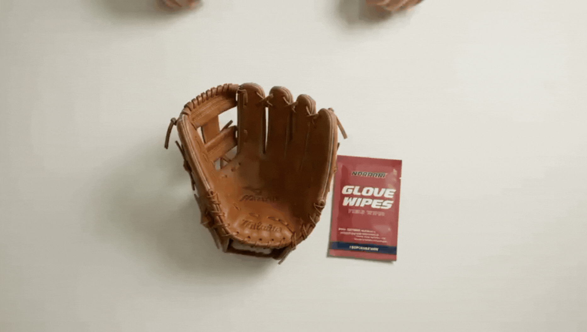 Opening a Nordari Field Wipe and cleaning a baseball glove